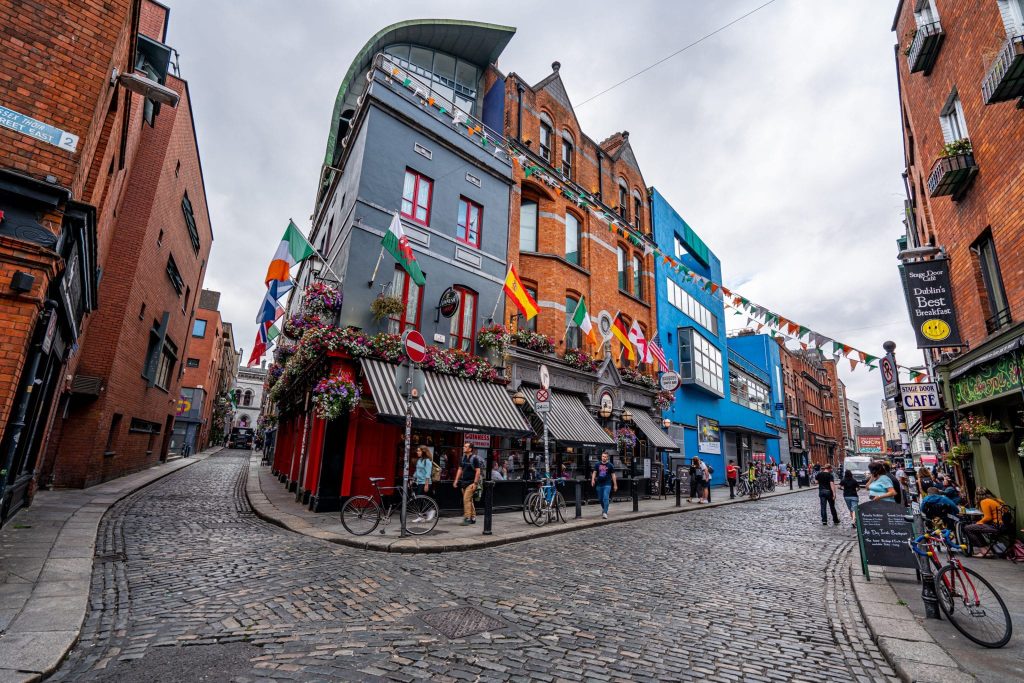 Bustling street market with colorful stalls and shoppers